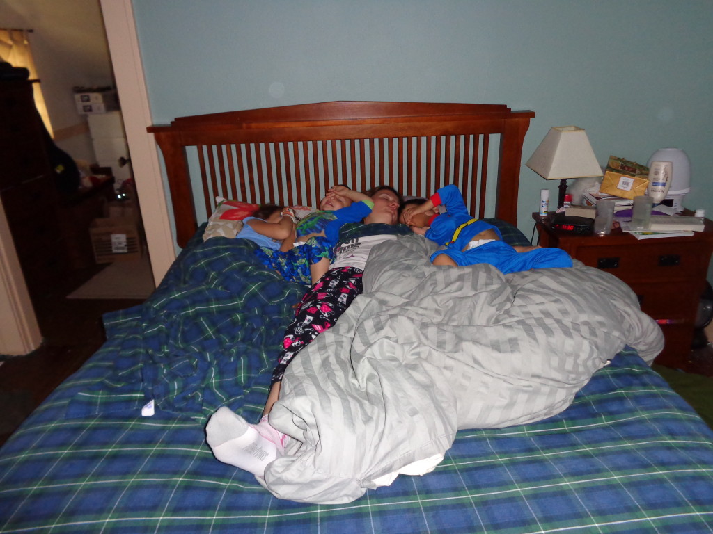 Mick, Lilliana, Bennett, and Harrison sleeping in our bed