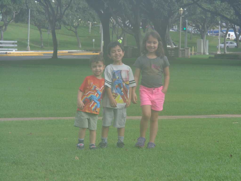 Three kids in a park - happy