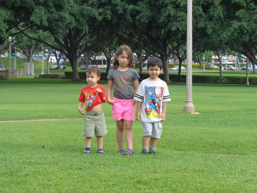 Three kids in a park - unhappy
